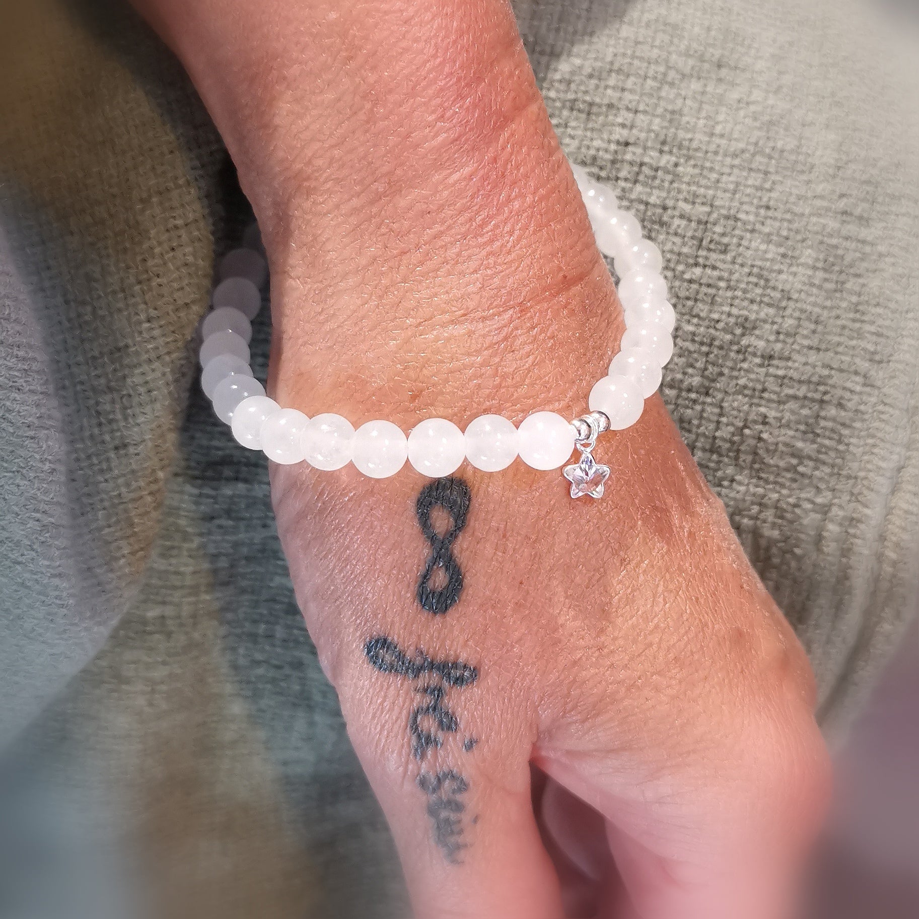 consecrated jade zircon starfish power animal healing stone karma bracelet, white, charm gemstone - lightbringer