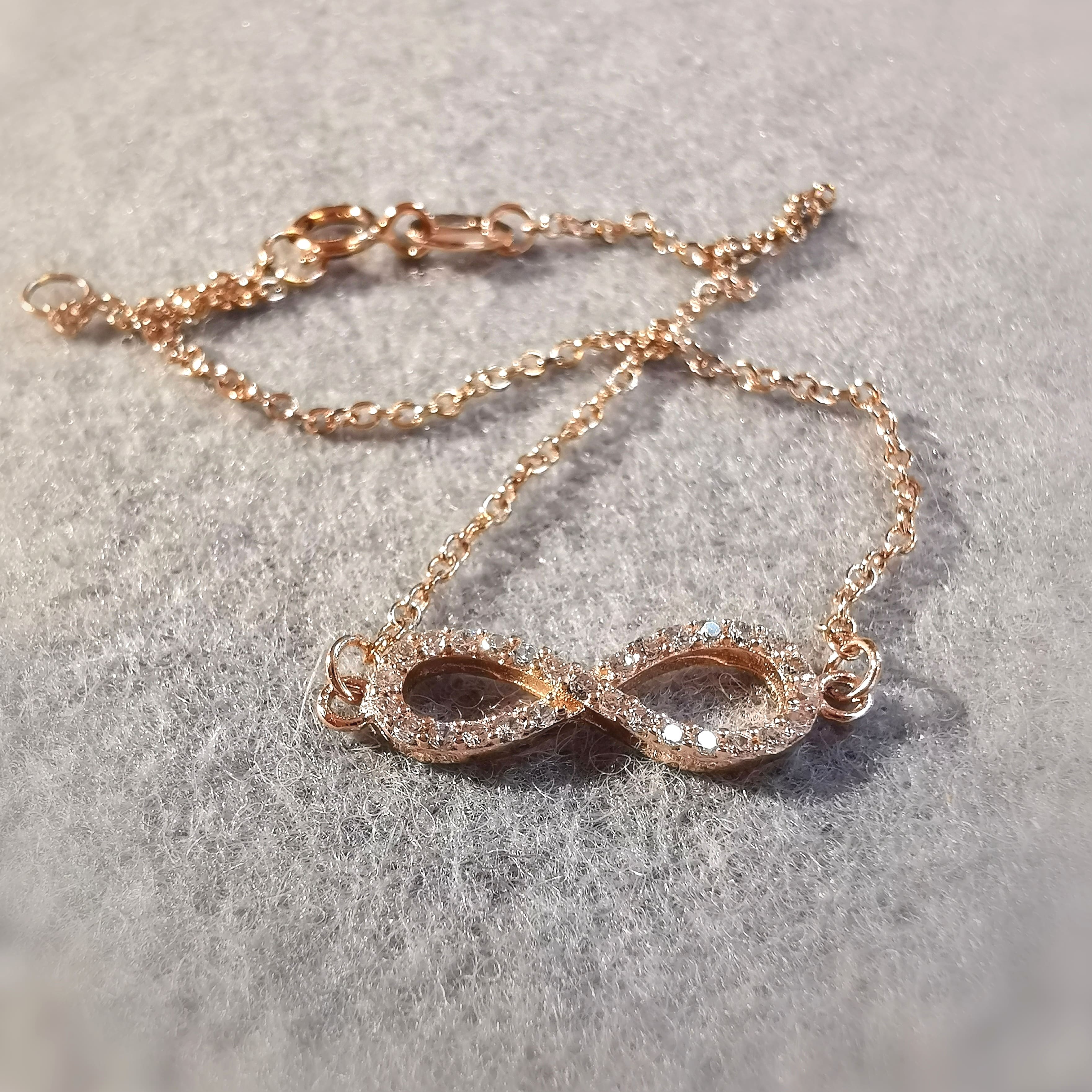 Unendlich Infinity Armband mit Swarovski Kristallen rose vergoldet - freier Energiefluss