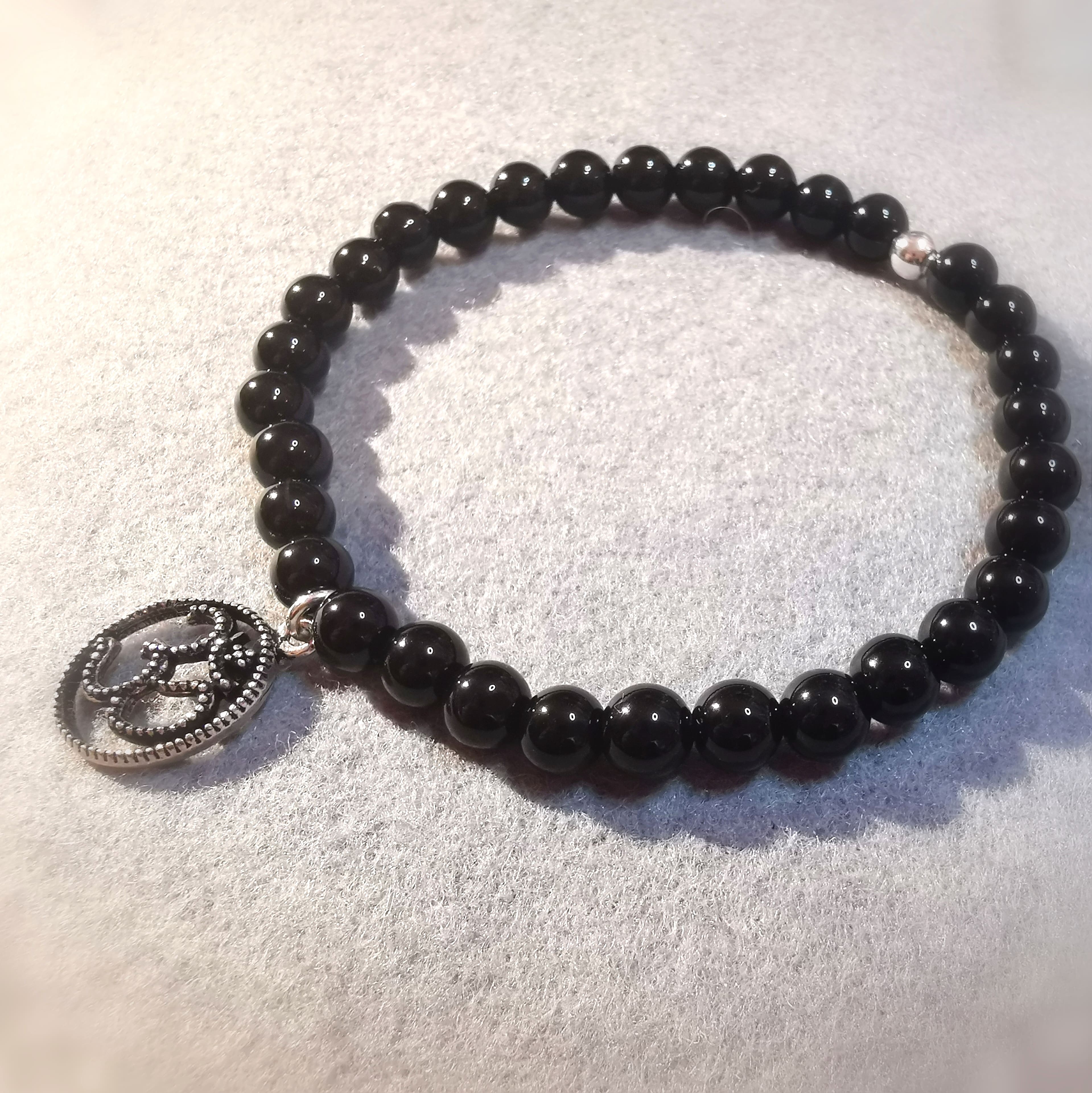 geweihtes Onyx extra AA Qualität mit OM Amulett Edelstein Karma Armband, Stabilität und Schutz