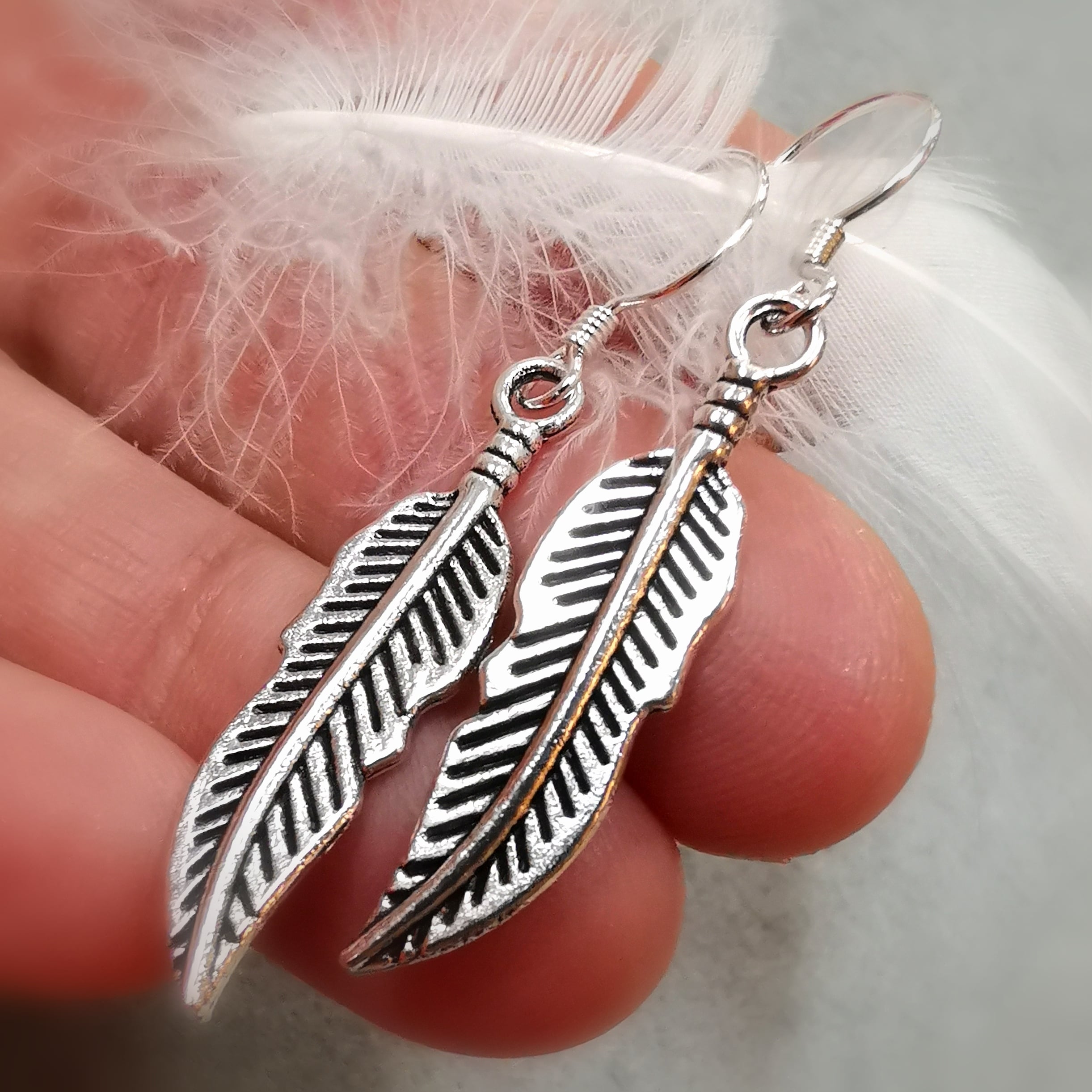 Feather earrings - symbol of light and lightness